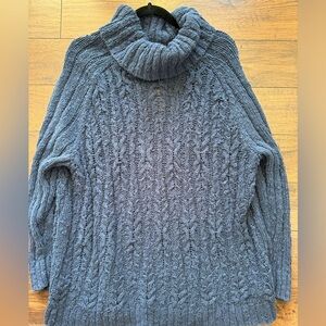 Large Free People knit sweater.